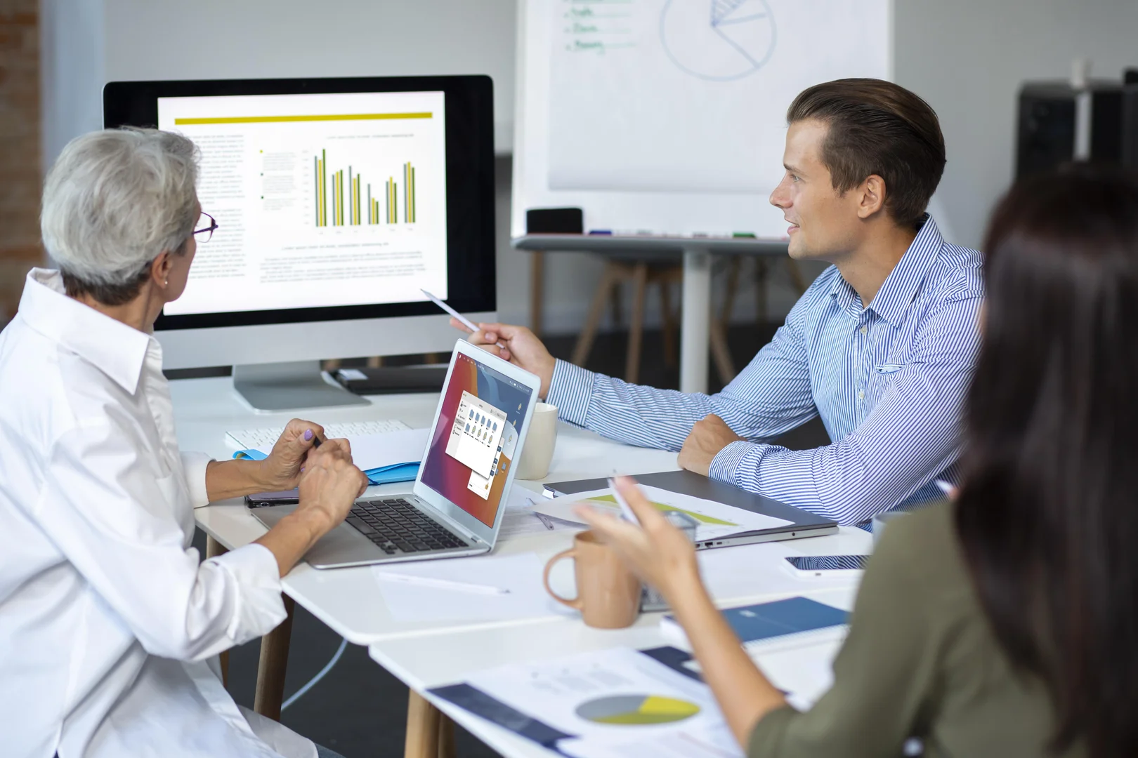 Administrators reviewing healthcare workflow analytics
